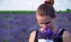 woman smelling lavender plants 700x420 1