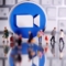 Илюстрацията показва 3D лого на Zoom, поставено между фигурки на хора, на фона на клавиатура (Dado Ruvic/Reuters, Illustration)