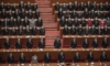 Китайският лидер Си Дзинпин (в средата) и депутати отдават чест на химна на конференцията на законодателния орган в Голямата зала на народа в Пекин, Китай – 11.03.2021 г. (Kevin Frayer/Getty Images)