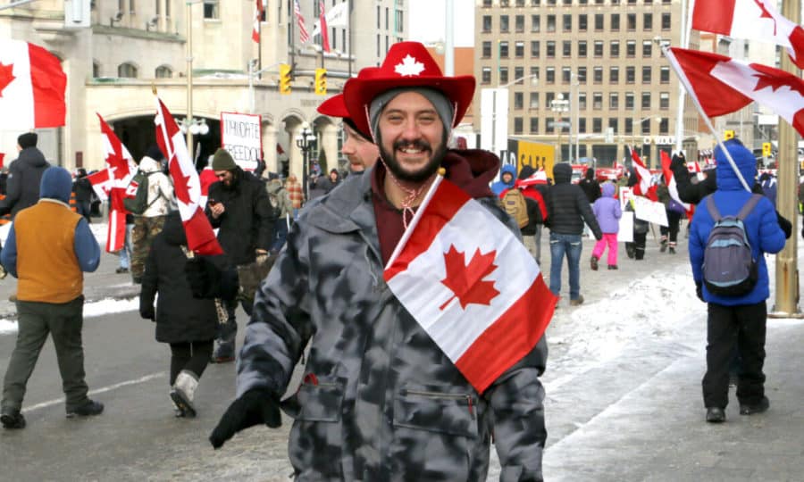 A protester walks on Wellington St. in Ottawa
