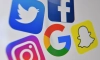 Логата на Facebook, Twitter, Instagram, Google и Snapchat. (Денис Чарлет/Getty Images)