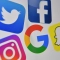 Логата на Facebook, Twitter, Instagram, Google и Snapchat. (Денис Чарлет/Getty Images)