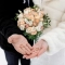 bride groom hold wedding rings their palms without face