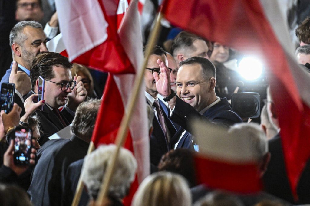 Karol Nawrocki waves to members of the public during the Law and Justice Party convention in Krakow, Poland, on Nov. 24, 2024. (Omar Marques/Getty Images)