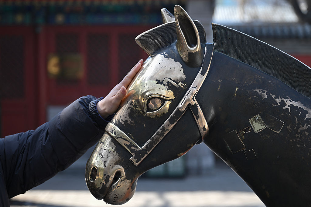 В Китай по-тихото празнуване на Лунната Нова година отрази икономическите трудности и неувереността